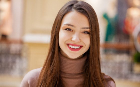 : a patient smiling after receiving root canal therapy in Rockville