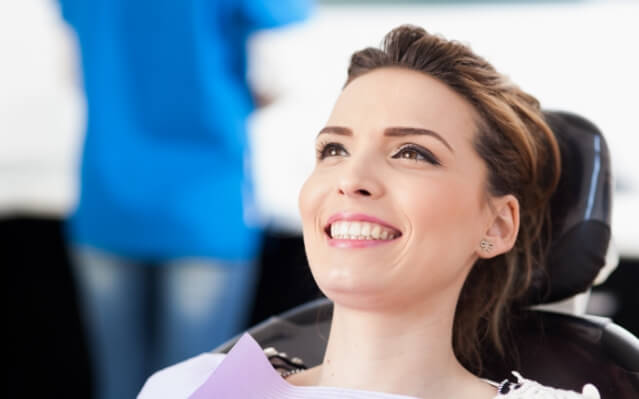 Woman with metal free dental restoration smiling