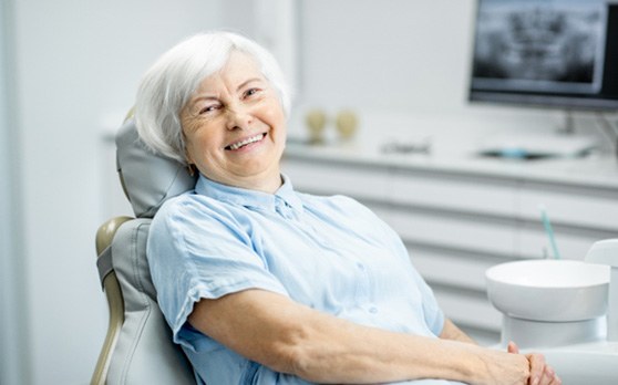 Woman with dentures in Rockville 