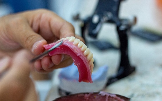 technician making dentures