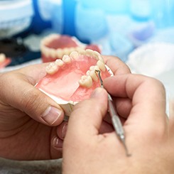 technician making dentures