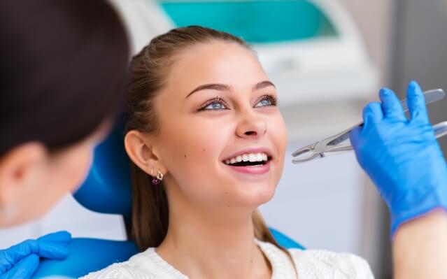 Woman receiving tooth extractions