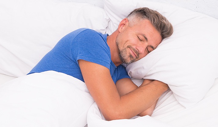 Man sleeping soundly on his side