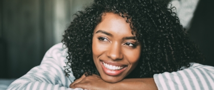 Woman resting her chin on her arm