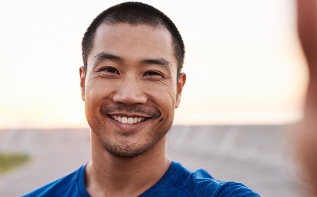 man smiling after getting Invisalign in Rockville