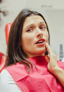 Woman with toothache at dentist