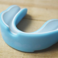Close-up of a mouthguard on a wooden table 