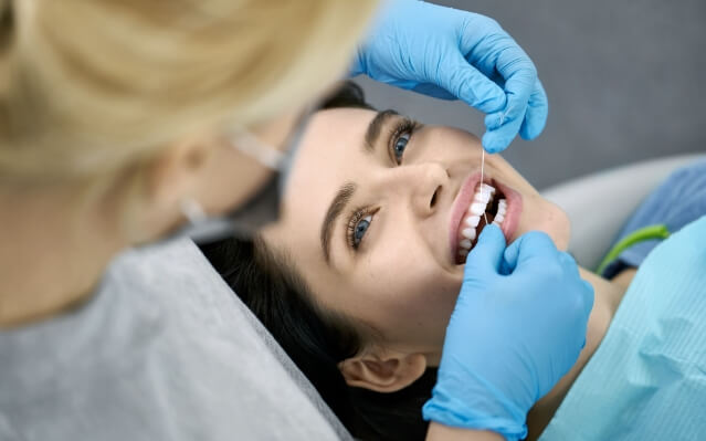 Patient replacing during preventive dentistry checkup and teeth cleaning
