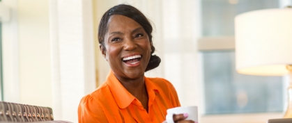 Woman sharing smile after replacing missing teeth